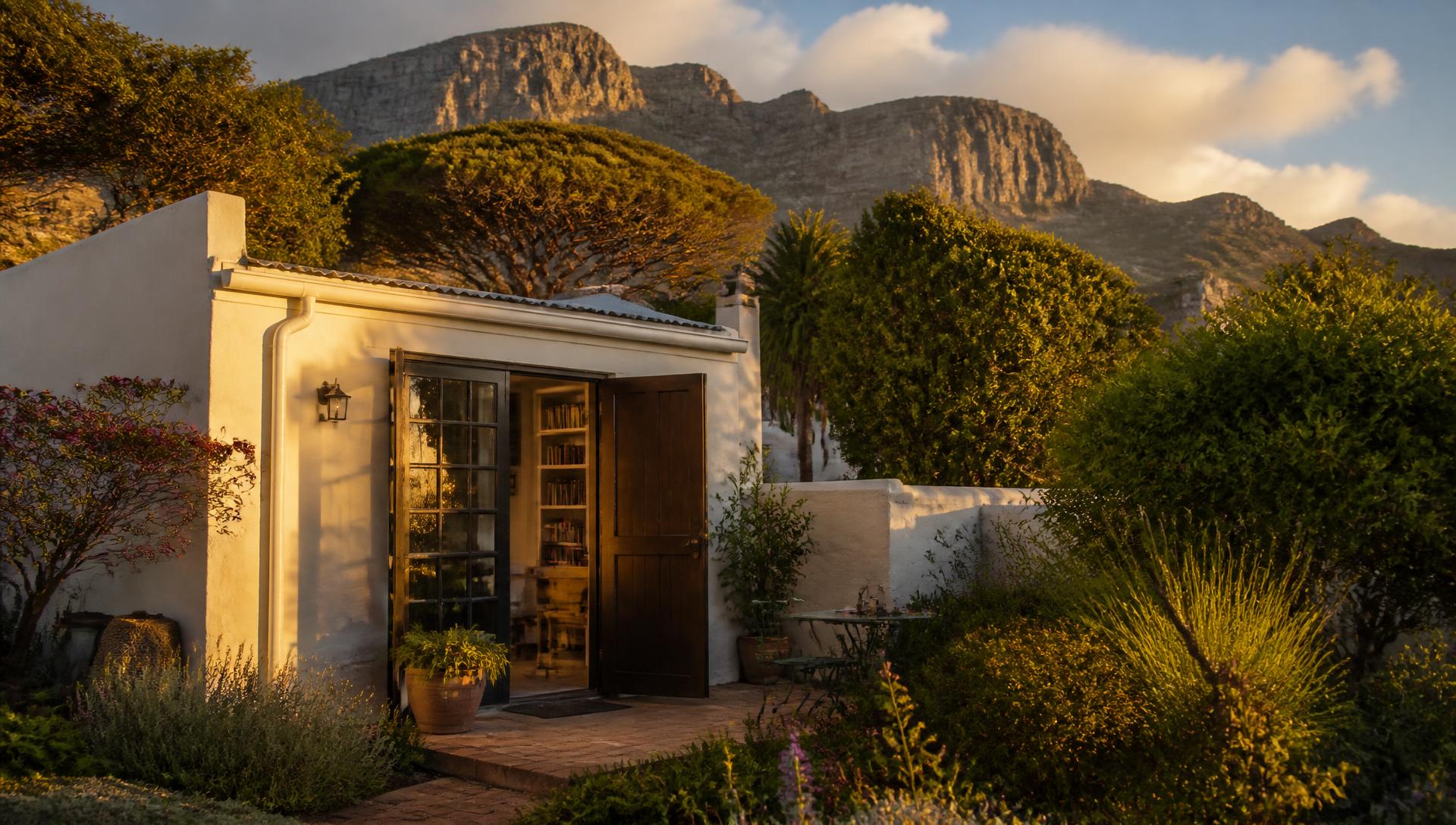 Private guest studio at golden hour with the mountain slopes rising behind it